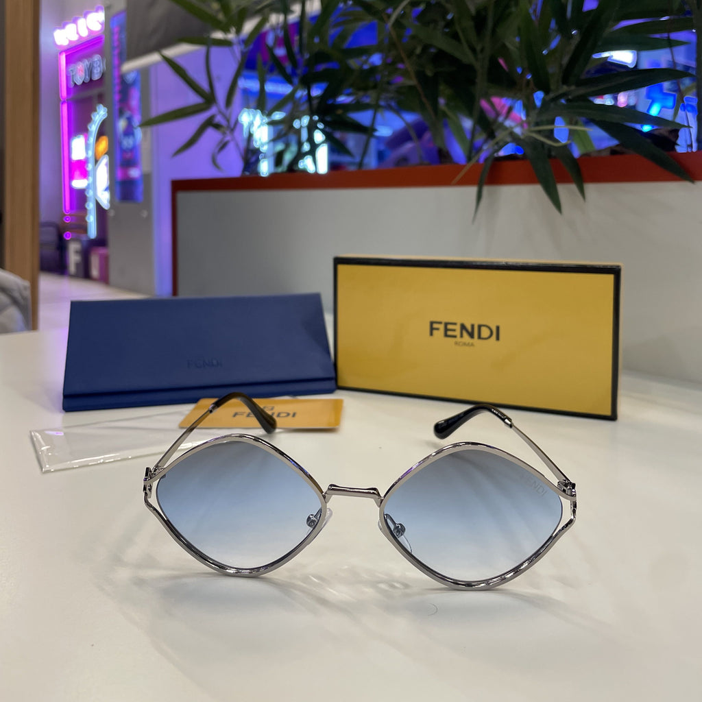 Lunettes Fendi - monture dorée avec verres bleu ciel dégradé