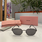 Lunettes Miu Miu Gris Noir Métallisé
