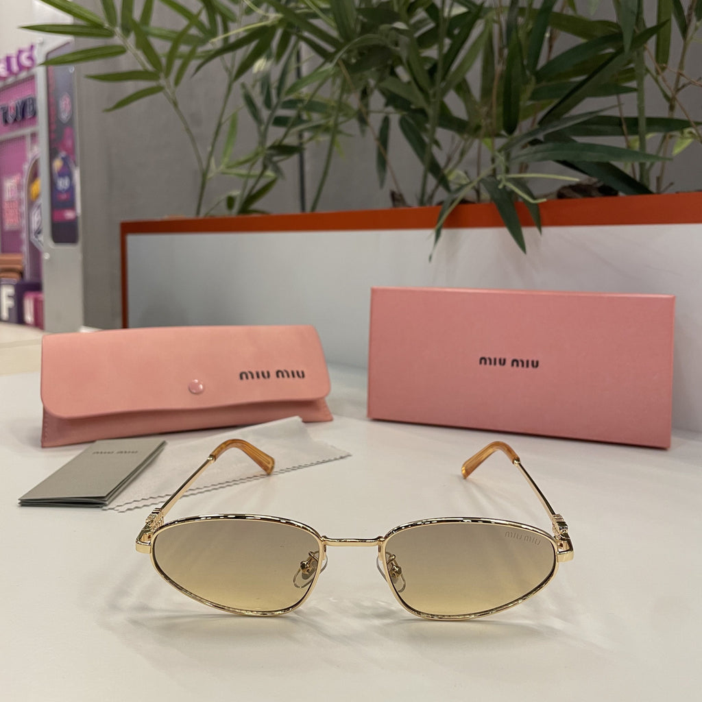 Lunettes MIU MIU Ovales Dorées – Verres Dégradés